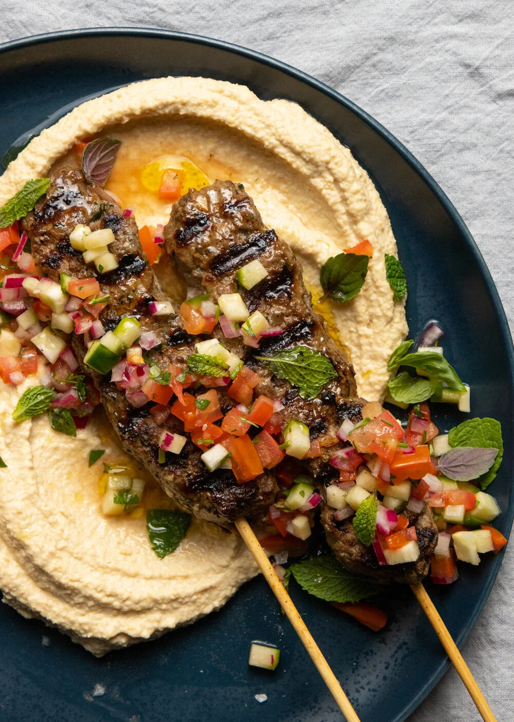 Middle eastern Hummus Super bowls with Laffa bread - with warm spicy chicken strips or Beef Kofta balls ,organic veggies, Feta, olives, lemon & herbs