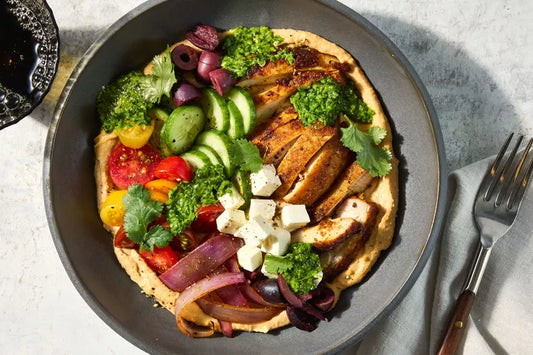 Middle eastern Hummus Super bowls with Laffa bread - with warm spicy chicken strips or Beef Kofta balls ,organic veggies, Feta, olives, lemon & herbs